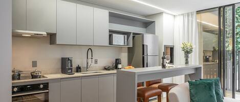 Comfort Apartment | Private kitchen | Full-size fridge, microwave, stovetop, coffee/tea maker