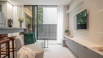 Comfort Apartment | Living area | 40-inch Smart TV with digital channels