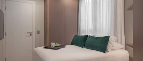 Departamento Gallery | Espacio para trabajar con laptop, wifi gratis y ropa de cama