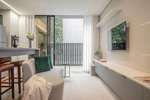 Comfort Apartment | Living area | 40-inch Smart TV with digital channels