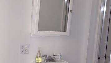 Shower, eco-friendly toiletries, towels, soap