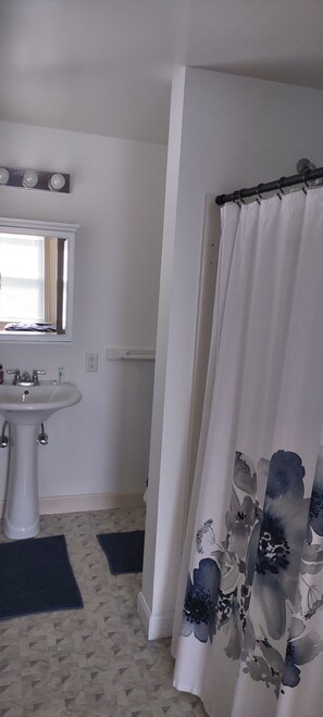 Shower, eco-friendly toiletries, towels, soap