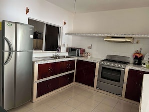 Fridge, microwave, stovetop, coffee/tea maker