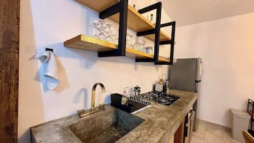 Fridge, microwave, stovetop, coffee/tea maker