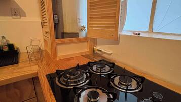 Fridge, microwave, stovetop, coffee/tea maker