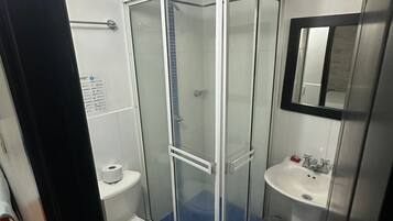 Basic Double Room | Bathroom | Shower, towels, soap, toilet paper