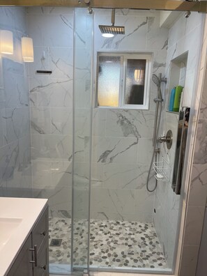 Shower, hair dryer, towels, soap