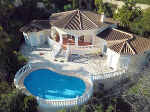 A large house with a swimming pool, multiple gazebos, and a stone patio. - Villa 'Vista 26' with Sea View, Wi-Fi and Air Conditioning (Unknown)