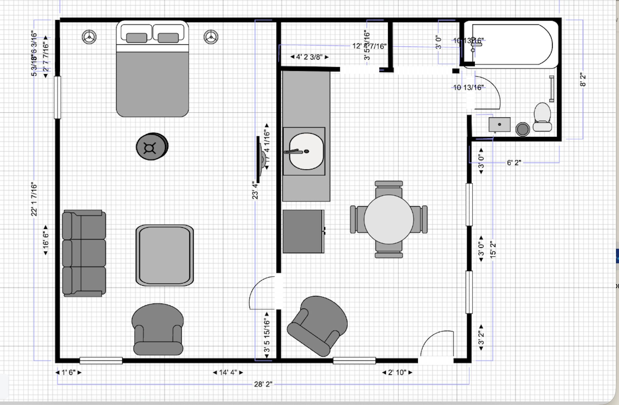 A floor plan of a hotel room with a bed, a desk, a chair, a sofa, a small table, and a bathroom.