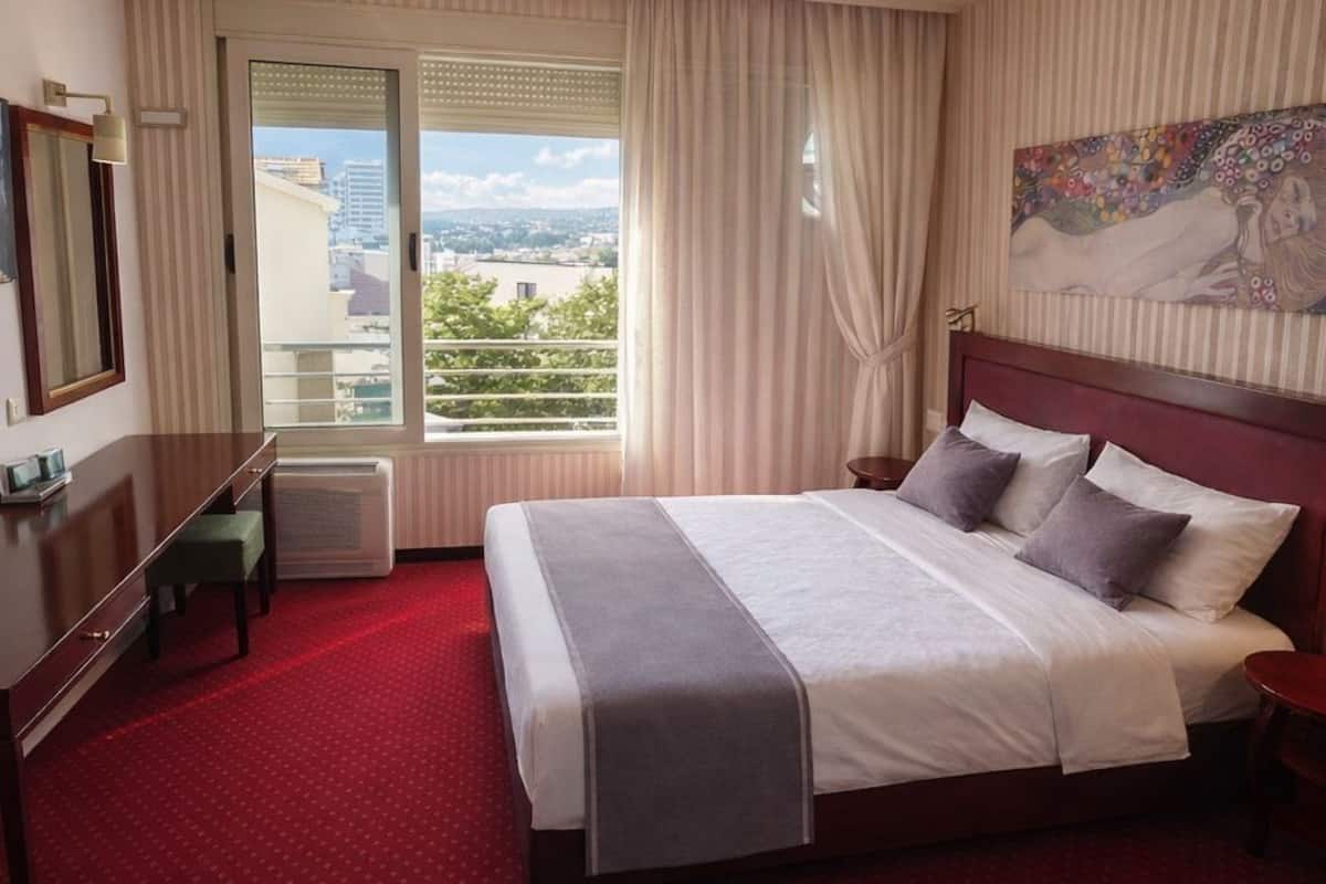 Premium bedding, desk, laptop workspace, soundproofing