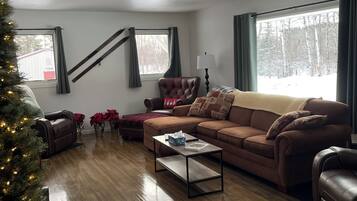 Smart TV, fireplace, table football, books