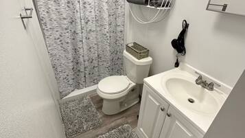 Hair dryer, towels, soap, toilet paper