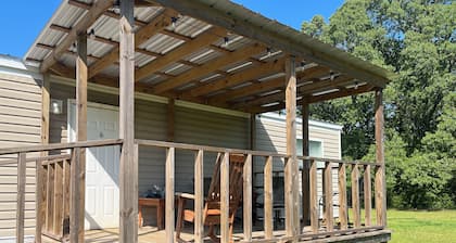 Cozy 2-BR MH in wonderful country setting. Short drive to Industrial Plants