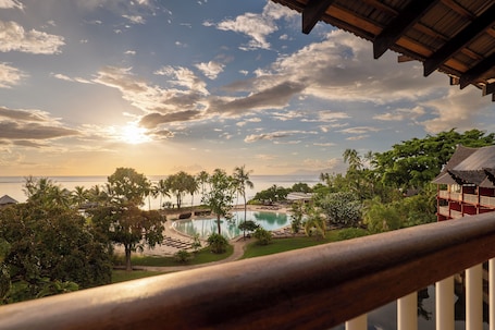 Outdoor pool, pool umbrellas, pool loungers. Tahiti Lagoon Resort