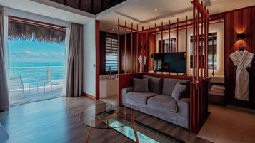 Luxury Bungalow, Lagoon View | Premium bedding, minibar, in-room safe, desk