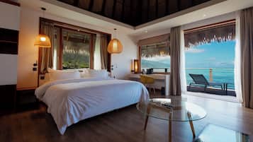Luxury Bungalow, Lagoon View | Premium bedding, minibar, in-room safe, desk