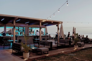 2 bars/lounges, poolside bar, beach bar