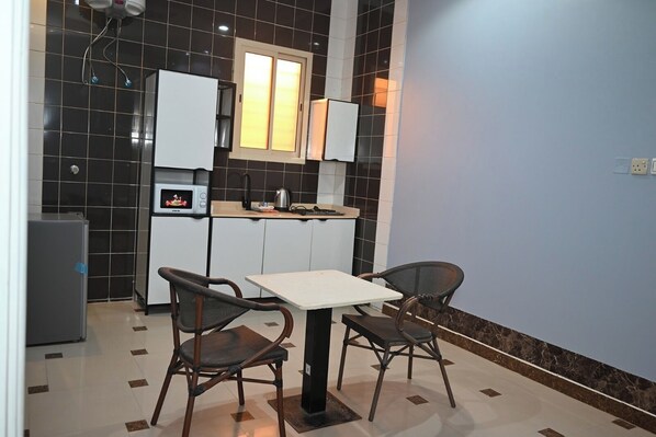 Apartamento executivo | Cozinha privada | Geladeira, micro-ondas, cooktop