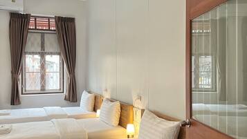 Deluxe Triple Room | Free minibar, desk, laptop workspace, blackout drapes