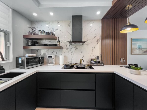 Fridge, microwave, stovetop, coffee/tea maker