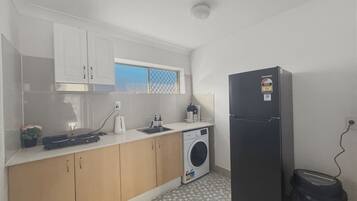 Fridge, stovetop, toaster, cookware/dishes/utensils