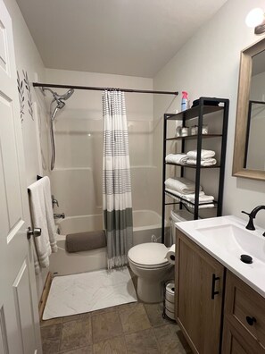 Shower, hair dryer, towels, soap