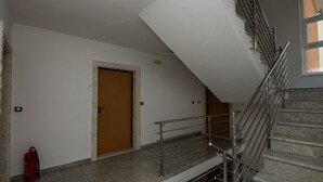 A staircase with metal railings leading to a landing. - Apartman Olivera-Trogir by Villas Guide (Seget Donji)
