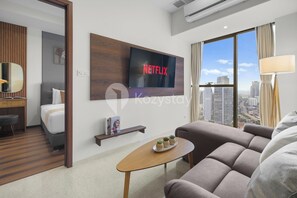 Apartment, 1 Bedroom, City View | Living room | 55-inch Smart TV with cable channels, Netflix, streaming services
