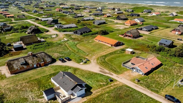 An aerial view of a coastal village with houses, some with thatched roofs, and a few with modern designs. - "Ava" - 350m from the sea by Interhome (Harboøre)