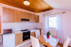 Apartment | Private kitchen | Fridge, microwave, oven, stovetop - Apartments Mali Paradiso - Comfort Studio Apartment With Balcony and Pool View (Zupa dubrovacka)