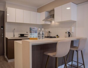 Fridge, microwave, stovetop, coffee/tea maker