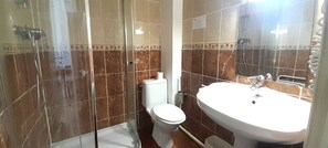 Shower, hair dryer, towels, toilet paper