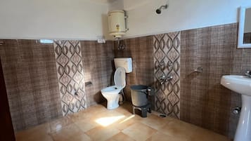 Shower, towels, soap, toilet paper