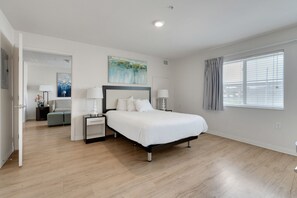 1 bedroom, desk, iron/ironing board, travel crib