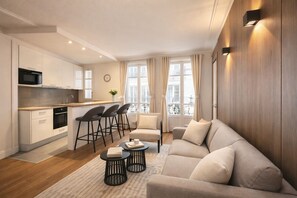 Superior Apartment, Courtyard View | Living area | 80-cm Smart TV with digital channels