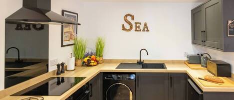 Microwave, coffee/tea maker, toaster, cookware/dishes/utensils