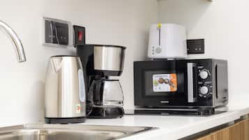 Monolocale Deluxe, balcone, vista città | Cucina privata