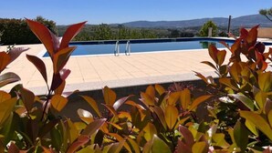 A swimming pool with a clear view of the surrounding landscape. - Tranca da Barriga by Quinta De São Tiago (Covilha)