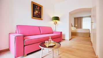 Junior Suite, Courtyard View | Living area | TV