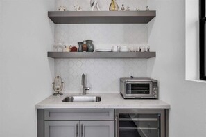 Microwave, coffee/tea maker, blender, cookware/dishes/utensils
