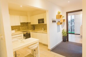 Fridge, microwave, electric kettle, cookware/dishes/utensils