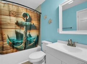 Shower, hair dryer, towels, toilet paper