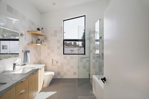 Shower, hair dryer, towels, soap