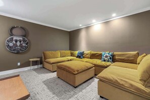 Smart TV, fireplace, books, computer monitors