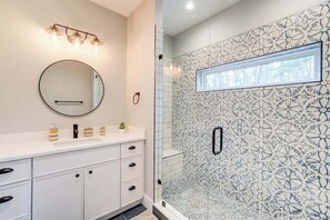 Shower, hair dryer, towels, shampoo
