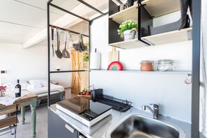 Fridge, microwave, stovetop, coffee/tea maker