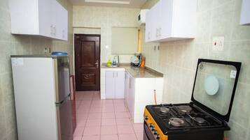 Deluxe Apartment, Balcony, City View | Private kitchen | Fridge, microwave, oven, stovetop