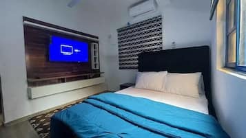 Deluxe Apartment, Balcony, City View | 1 bedroom, desk, laptop workspace, blackout curtains