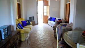 A living room with two sofas, a glass coffee table, and a television. - Beautiful property in southern Portugal (Algarve) near Estômbar golf course (Unknown)