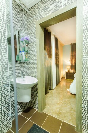 Shower, eco-friendly toiletries, towels, soap